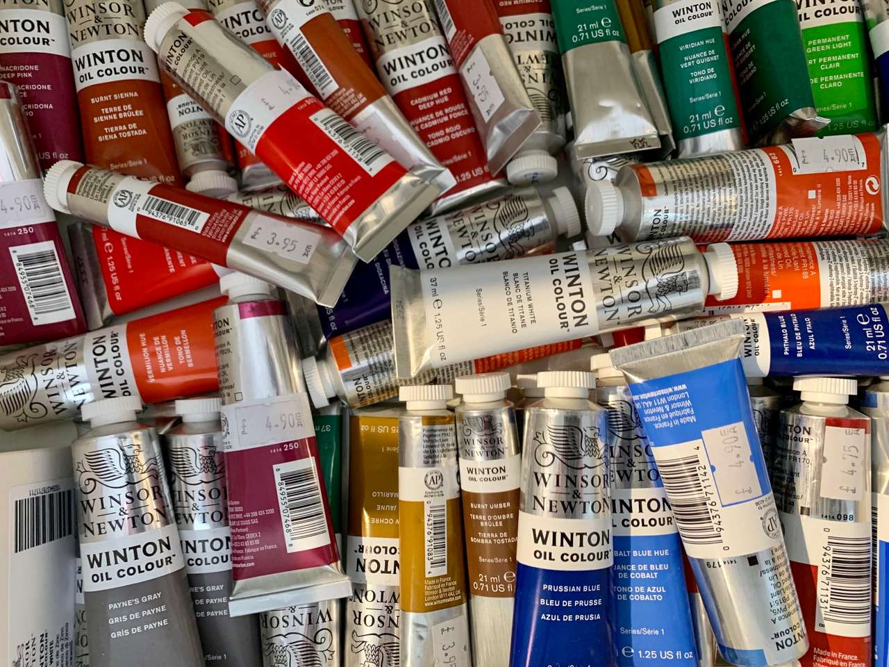 A tray of Winsor & Newton Winton oil colour tubes in many colours