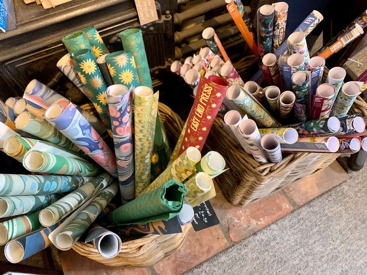 Baskets of rolled marbled and patterned wrapping paper